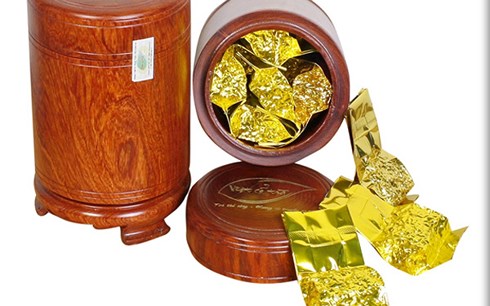 Chi tiền triệu mua 2 USD hình chó mạ vàng biếu Tết